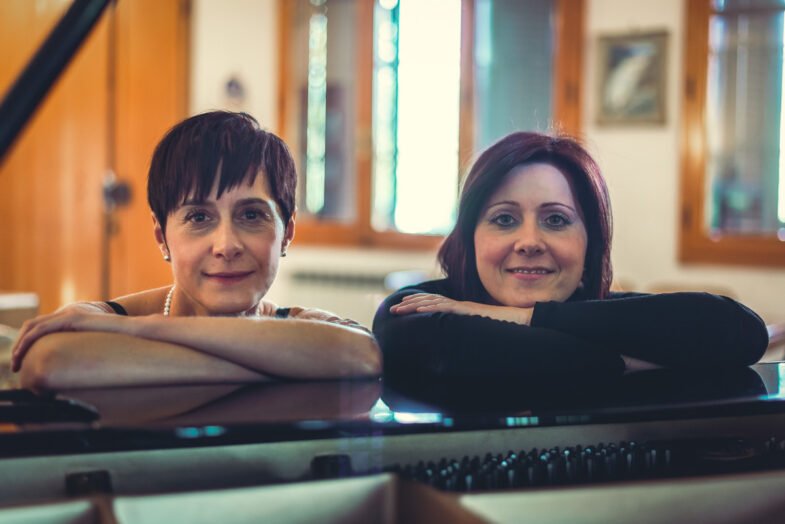 Girls sittings at the piano