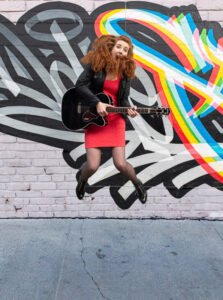Musician in Dublin with a coloured wall