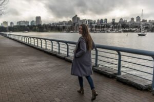 Girl walking at sea side in Vancouver